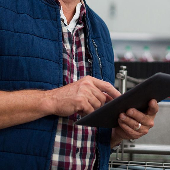 Factory worker reviewing a report