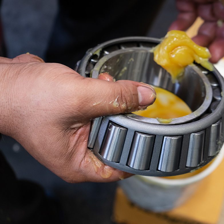 Putting lithium grease into wheel bearing for ten wheel track by